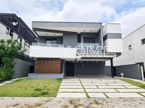 Casa moderna com fachada cinza e garagem