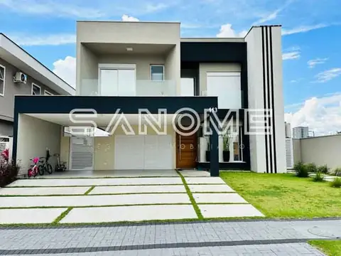 Fachada de casa moderna com garagem e entrada
