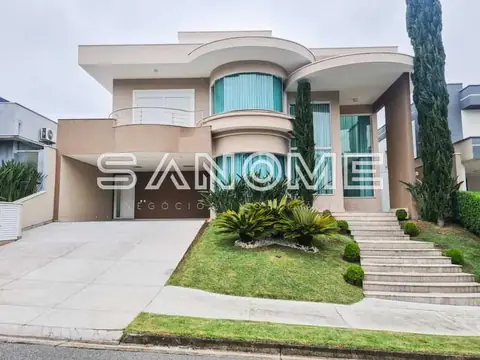 Casa moderna com fachada curva e garagem