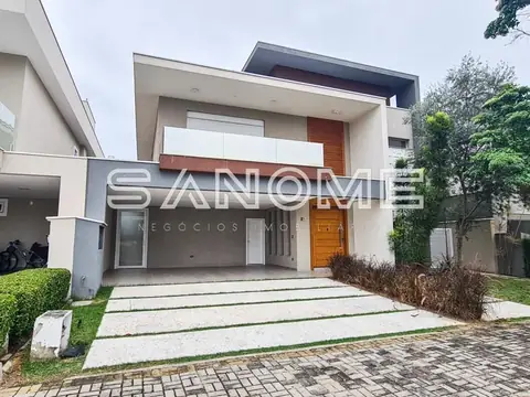 Fachada de casa moderna com garagem e entrada