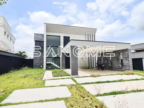 Casa moderna com fachada de blocos cinza e garagem