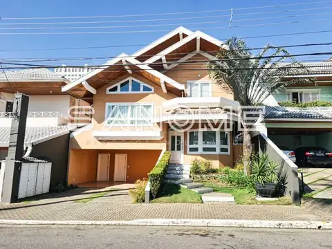 Fachada de casa com garagem dupla e telhado em duas águas