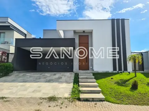 Fachada de casa moderna com garagem preta