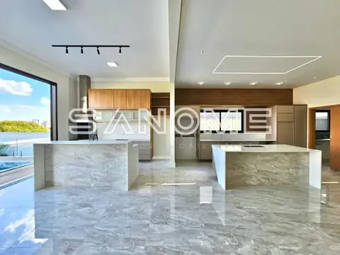 Sala de estar com piso de mármore e bancada